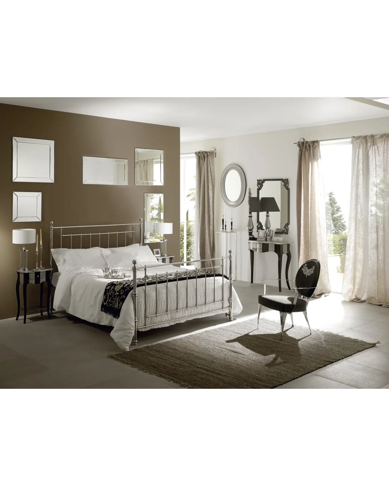 Bedroom with a brass bed, a writing desk and a chair, high end furniture stores in London