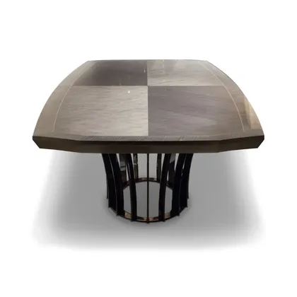 Unique boat-shaped oval dining table offering a sophisticated silhouette for formal modern dining spaces.